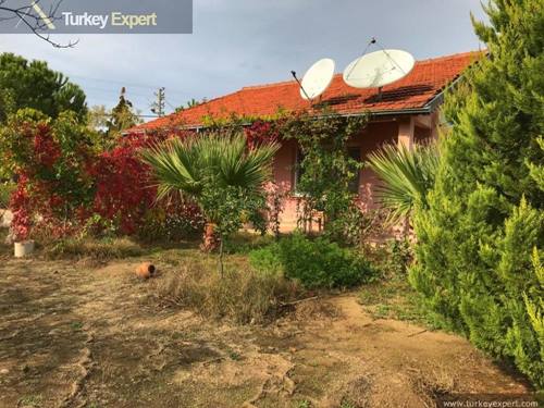 Farm house with a separate guest house on a 11000 m2 land for sale in Kusadasi, good potential