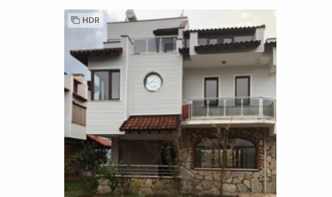 Detached villa with 6 bedrooms for sale in Antalya on a beach front complex