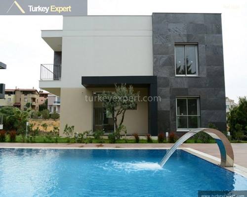 Villa for sale in Izmir Guzelbahce with a communal pool
