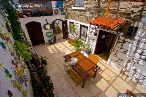 Traditional stone house for sale with yard and sea view in Bodrum center