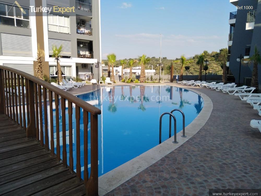 Neubauwohnung im Zentrum von Kusadasi mit Pool und Tiefgarage 0