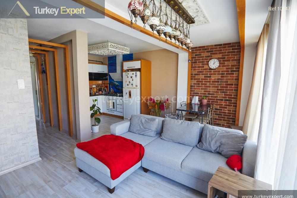 Cozy top floor resale flat with a roof terrace in Izmir Alsancak 2