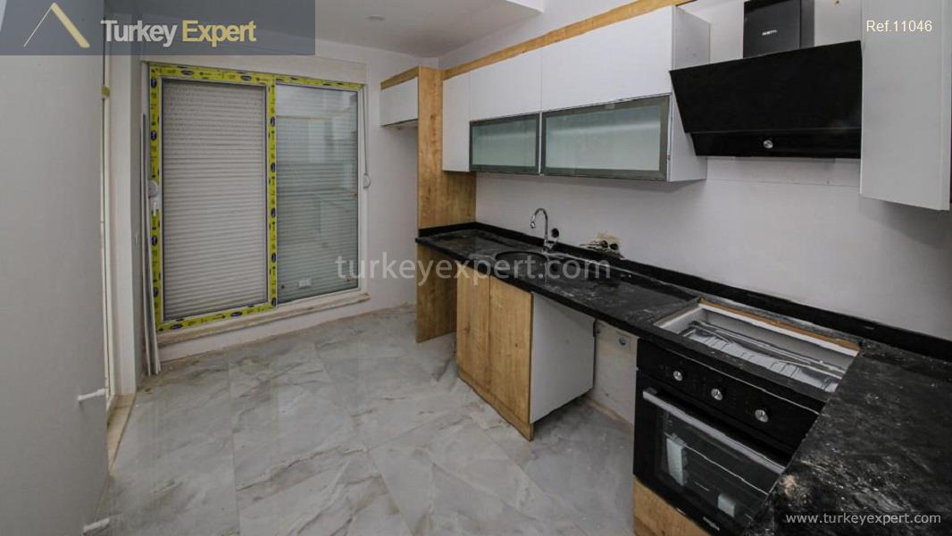 7apartments in alany kepez with a swimming pool and parking8