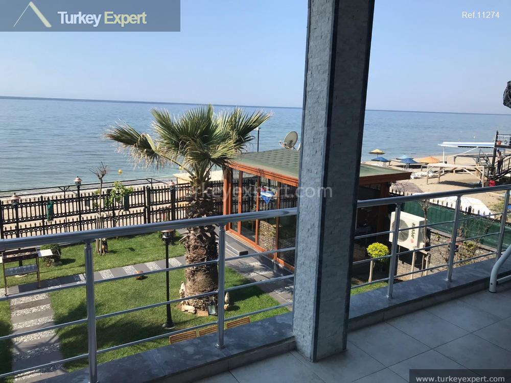A complete building for sale right on the beach in Istanbul containing 8 apartments, 2 shops 1