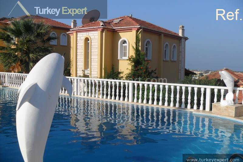 Detached villa for sale in Kusadasi Sogucak with sea views in a gated resort 1